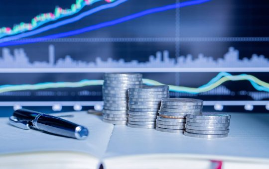 stack-money-coin-with-trading-graph_1150-17752